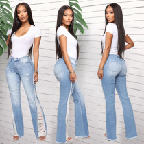 Large jeans with small holes