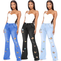 Slim fitting butterfly embroidered elastic flare pants
