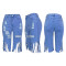 Fashionable tassels with holes in stretch cropped jeans