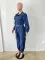 Fashionable streetwear with waistband for a slimming figure. Multi mouth bag with elastic waist, denim workwear jumpsuit