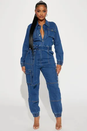 Fashionable streetwear with waistband for a slimming figure. Multi mouth bag with elastic waist, denim workwear jumpsuit