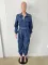 Fashionable streetwear with waistband for a slimming figure. Multi mouth bag with elastic waist, denim workwear jumpsuit