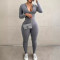 Solid color tight fitting invisible zipper jumpsuit with long sleeves