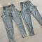 Irregular hollow splicing zipper elastic jeans