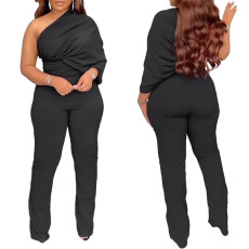 Solid color irregular shoulder single sleeve pleated jumpsuit