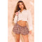 Fashionable and versatile classic plaid skirt with floral buds as the base