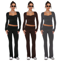 Solid color fashion low neck long sleeved sexy low waist flared pants two-piece set