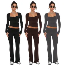 Solid color fashion low neck long sleeved sexy low waist flared pants two-piece set