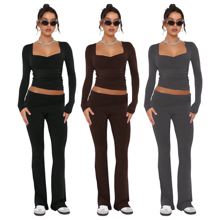 Solid color fashion low neck long sleeved sexy low waist flared pants two-piece set