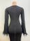 Women's feather long sleeved dress with buttocks wrapped in a mid length skirt, exuding a high-end and slimming vibe