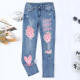 New pink heart-shaped pattern straight leg ripped jeans printed pants