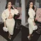 Two piece set of cardigan silhouette sweater with hip wrap skirt