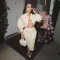 Two piece set of cardigan silhouette sweater with hip wrap skirt