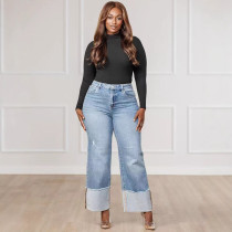 Women's solid color washed pants with folded legs and hip hugging long jeans in stock