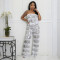 A sexy two-piece set of strapless top and loose pants