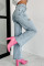 Women's washed denim jeans with multiple pockets and hand drilled opening