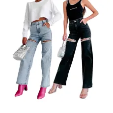 Women's washed denim jeans with multiple pockets and hand drilled opening