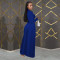 Fashionable women's dress with a cinched waist and crossed collar, long sleeved dress