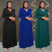 Fashionable women's dress with a cinched waist and crossed collar, long sleeved dress