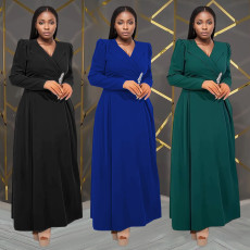 Fashionable women's dress with a cinched waist and crossed collar, long sleeved dress