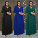 Fashionable women's dress with a cinched waist and crossed collar, long sleeved dress