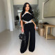 Personalized wave line splicing sleeveless wide leg jumpsuit