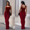Fashionable women's dress with a waist cinched, backless, sleeveless, and hip hugging design