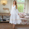 Casual long sleeved white V-neck dress, mid length skirt without waistband