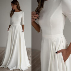Elegant and minimalist round neck wedding dress with three quarter sleeves