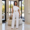 Fashionable women's clothing with elegant sloping shoulder belt and solid color jumpsuit