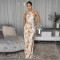 Hanging neck sleeveless top with printed waistband jumpsuit