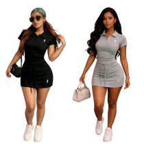Two piece top with distinctive short skirts on both sides, drawstring and logo