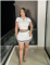 women's new color blocked knitted sweater with exposed waist, POLO collar, short sleeved pleated skirt two-piece set