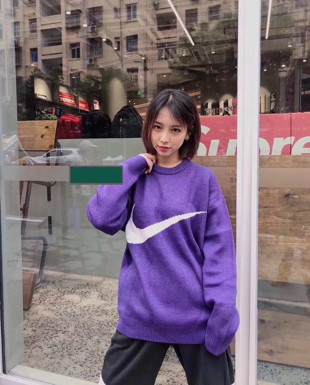supreme swoosh sweater
