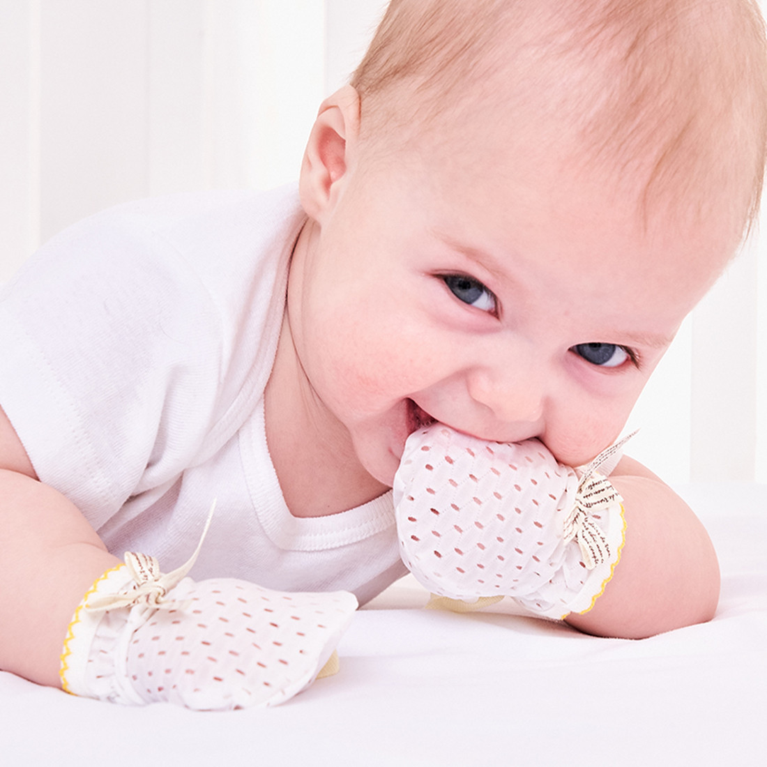 Baby with mittens